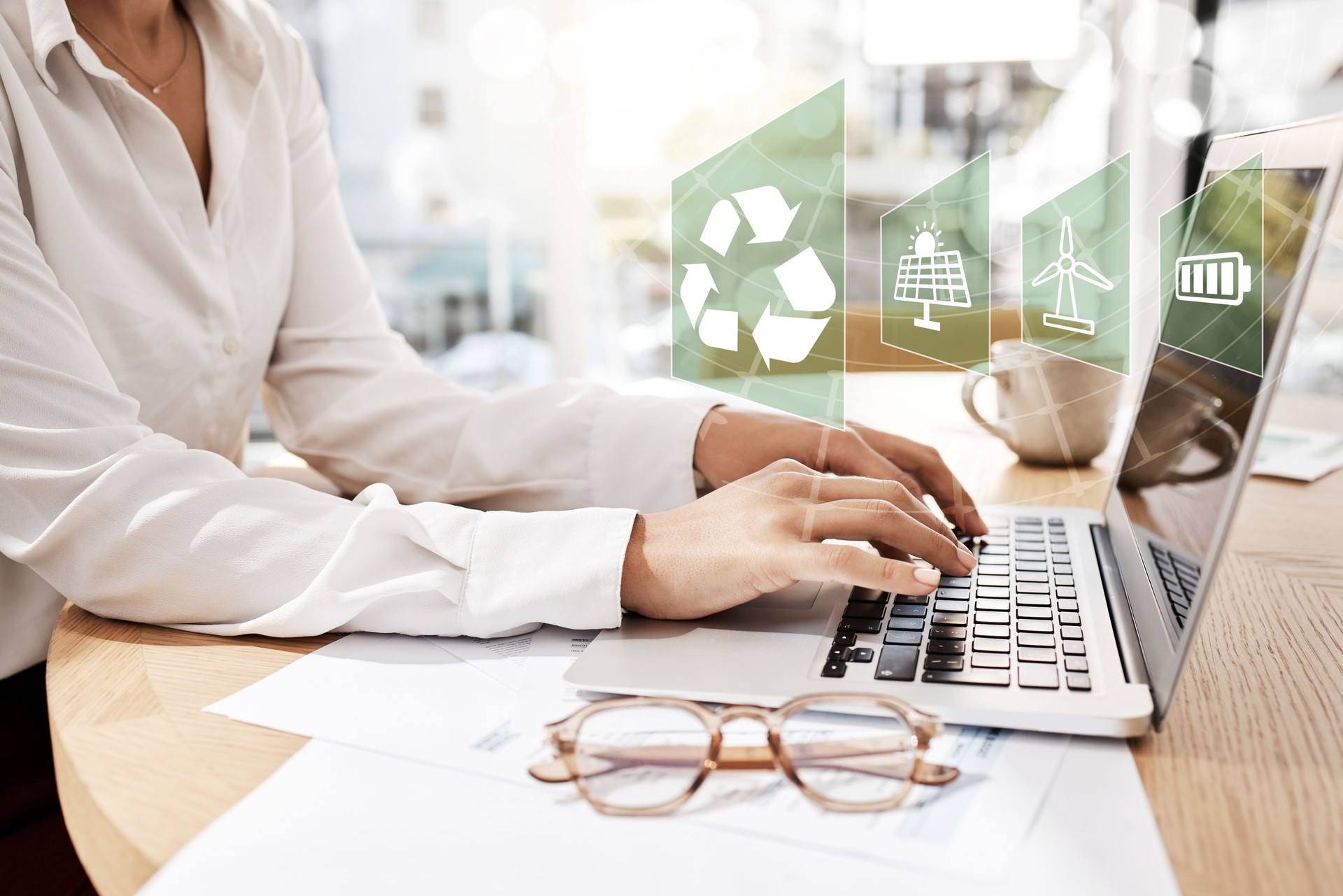 Business, people and typing on laptop in office for overlay, sustainable and recycling electricity. Corporate, online innovation and solar panel, wind turbine and renewable energy of battery progress